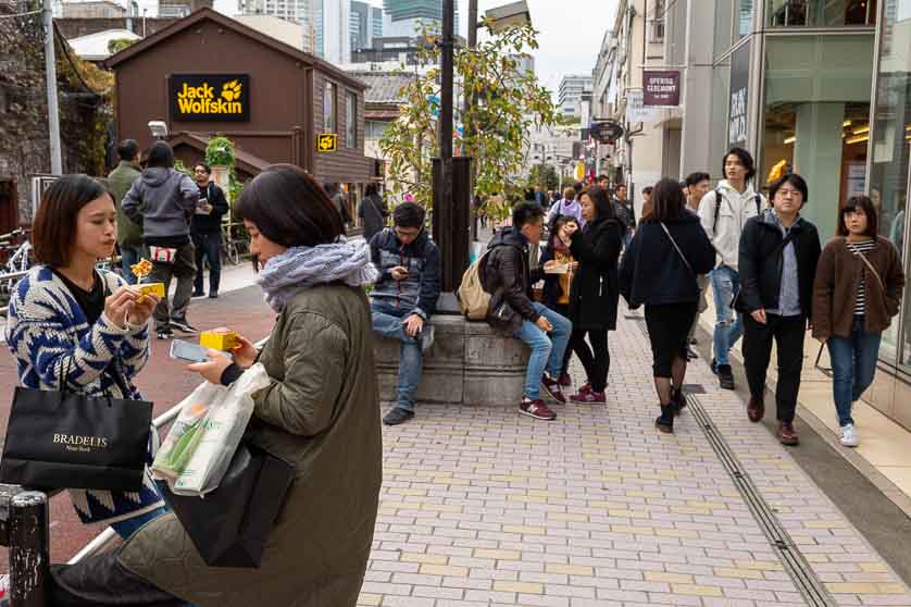 Enjoying snacks on Cat Street, Shibuya, Tokyo.