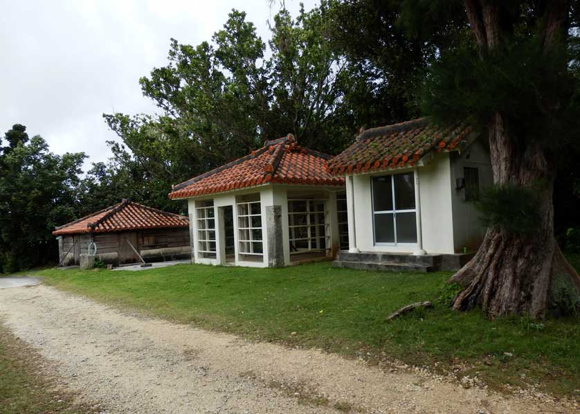 The sea snake smokehouse on the left with two traditional Okinawan sacred rooms.