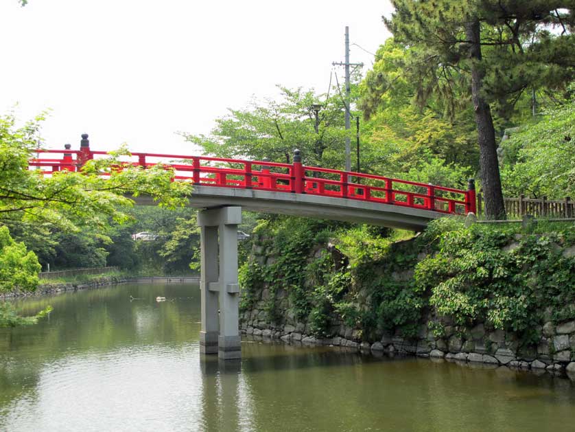 Okazaki Castle Park with castle moat and bridge.