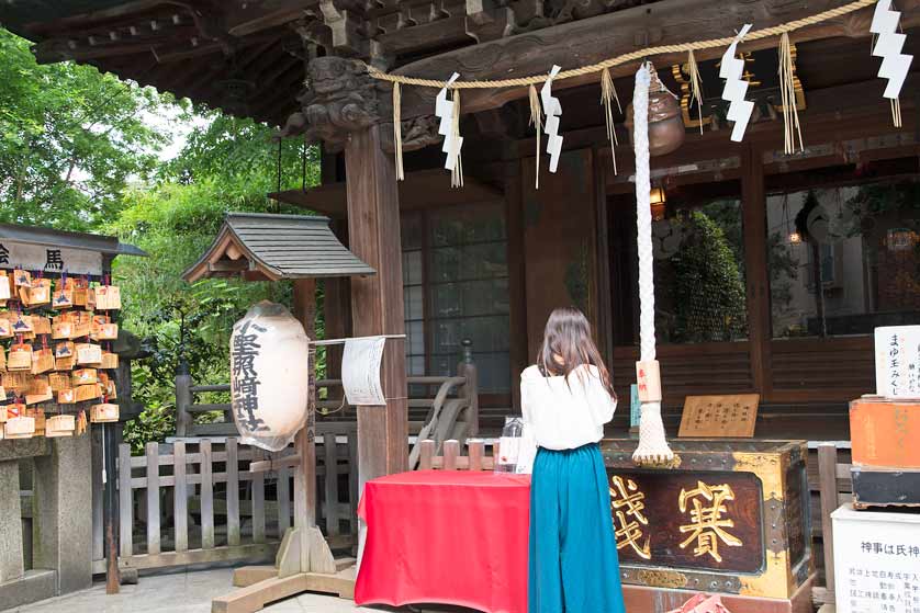 Praying at Onoterusaki Shrine, Shitaya, Taito, Tokyo.