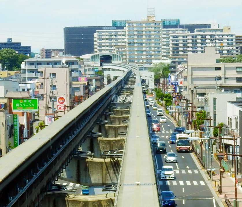 Monorail tracks seen from a train rear window.