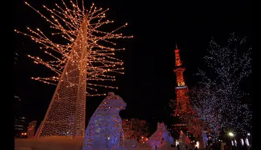 Illuminated trees and ice sculptures line the streets leading up to Sapporo's TV Tower during the Sapporo Ice Festival.