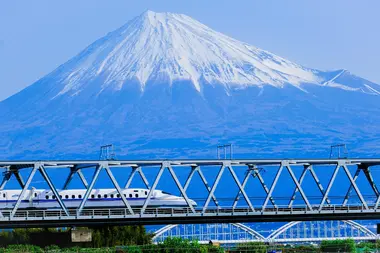 The Shinkansen bullet train going past Mount Fuji