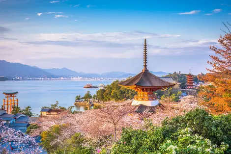 The sacred island of Miyajima and its famous torii with feet in water, worth a visit off Hiroshima in Japan