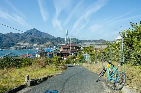 A small fishing village and a view of Kurushima bridge along the Shimanami Kaido.