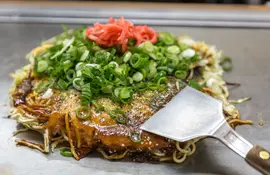 Traditional Japanese okonomiyaki, savory pancake