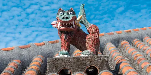 The island village of Taketomi. The houses are often surmounted by shisa, the mythical animal of the archipelago.